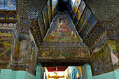 Paintings on the wall of the outer cloister of the Mahamuni Paya, Mandalay, Myanmar 